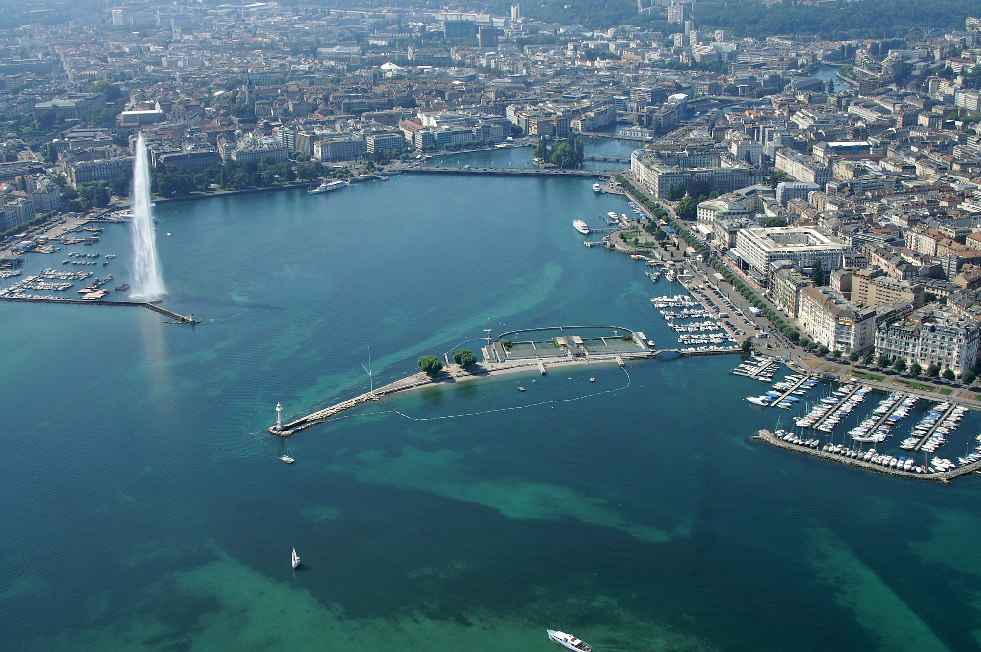 Elegant Junior suite at the Intercontinental Geneve hotel with panoramic views of Lake Geneva, ideal for corporate executives and diplomatic stays.